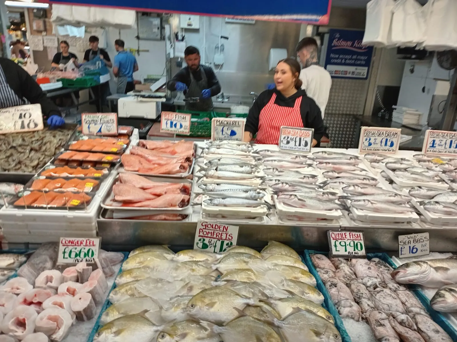 A fishmonger stall displaying a wide range of fresh fish